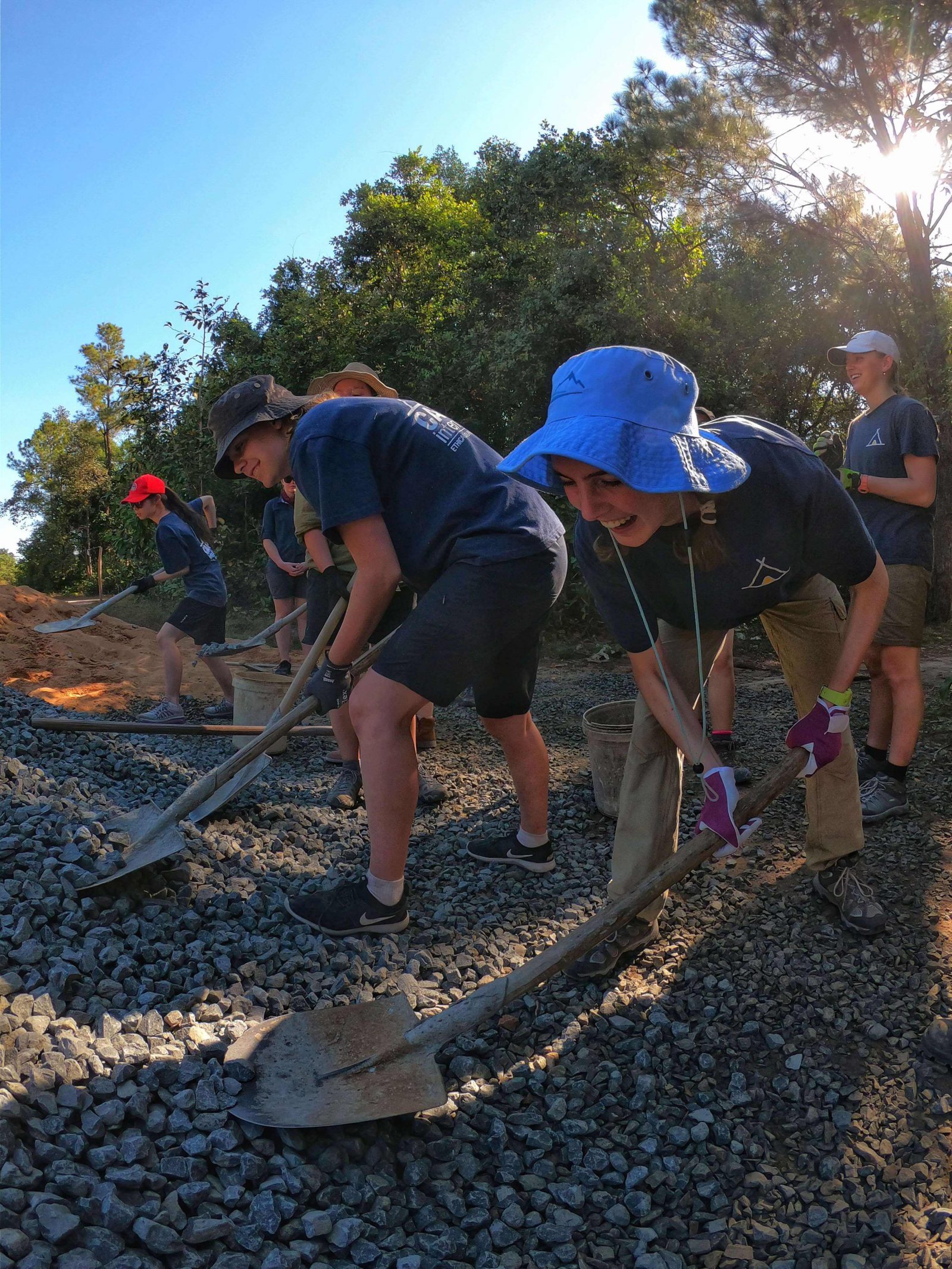 Camps International Students digging on project work