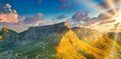 Sun shining on one side of Table mountain.