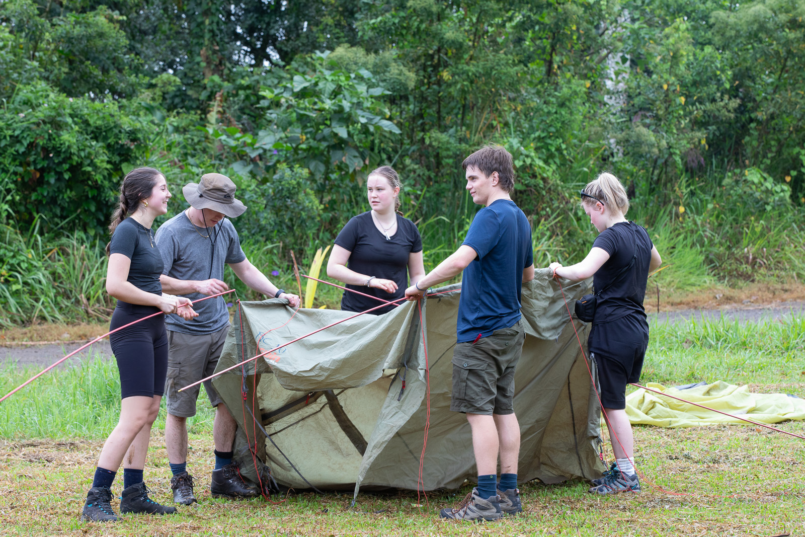Travellers putting up a tent, Costa Rica