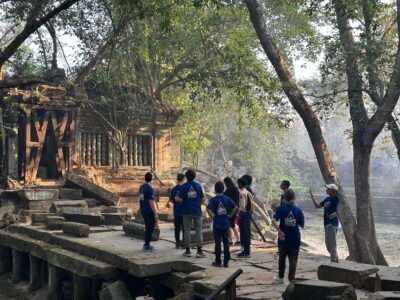 Group of travellers exploring a temple in Cambodia