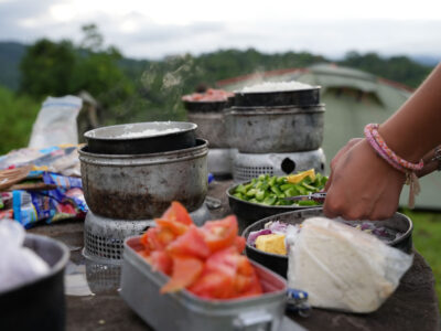 Travellers cooking a meal on a trek, Costa Rica