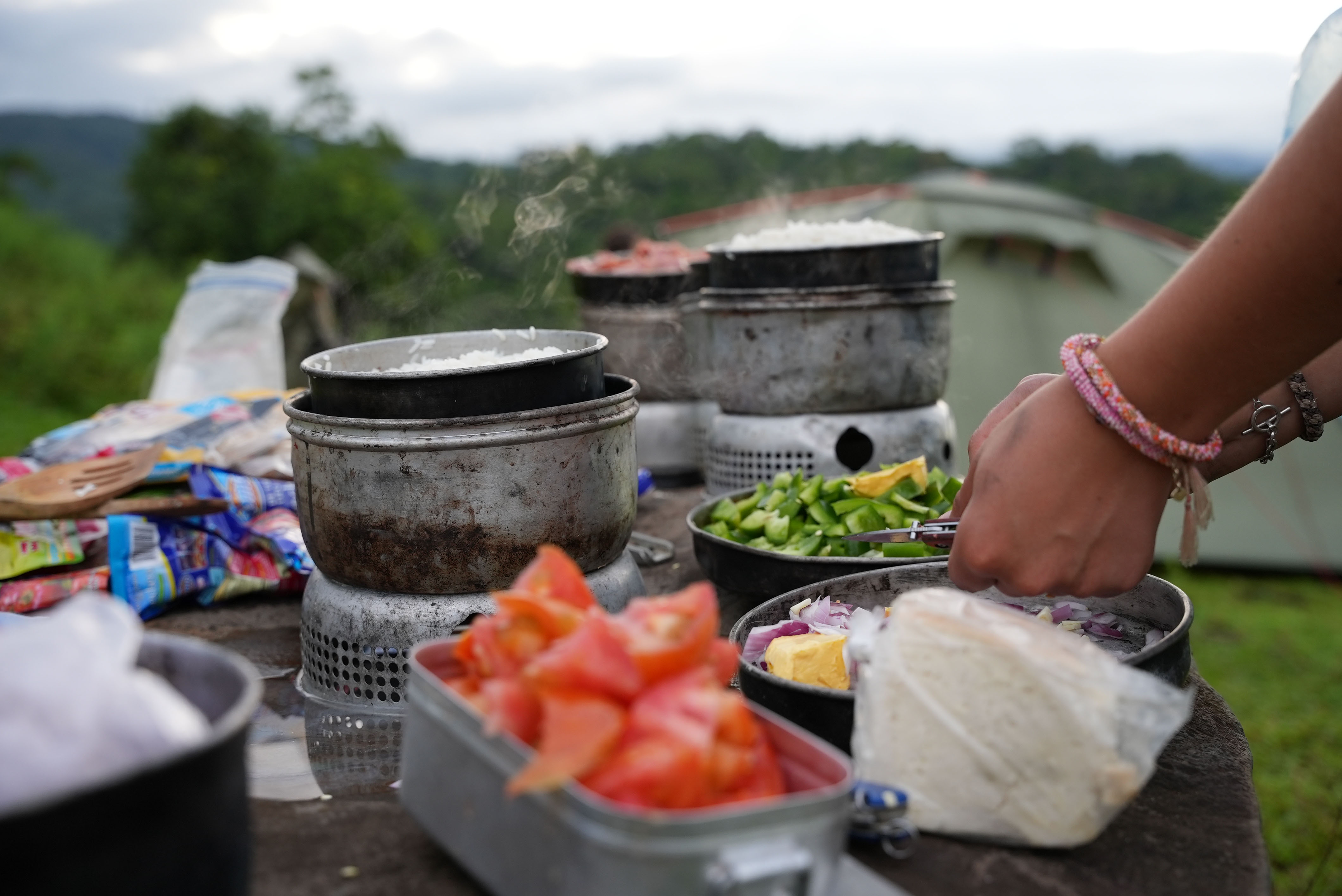 Travellers cooking a meal on a trek, Costa Rica