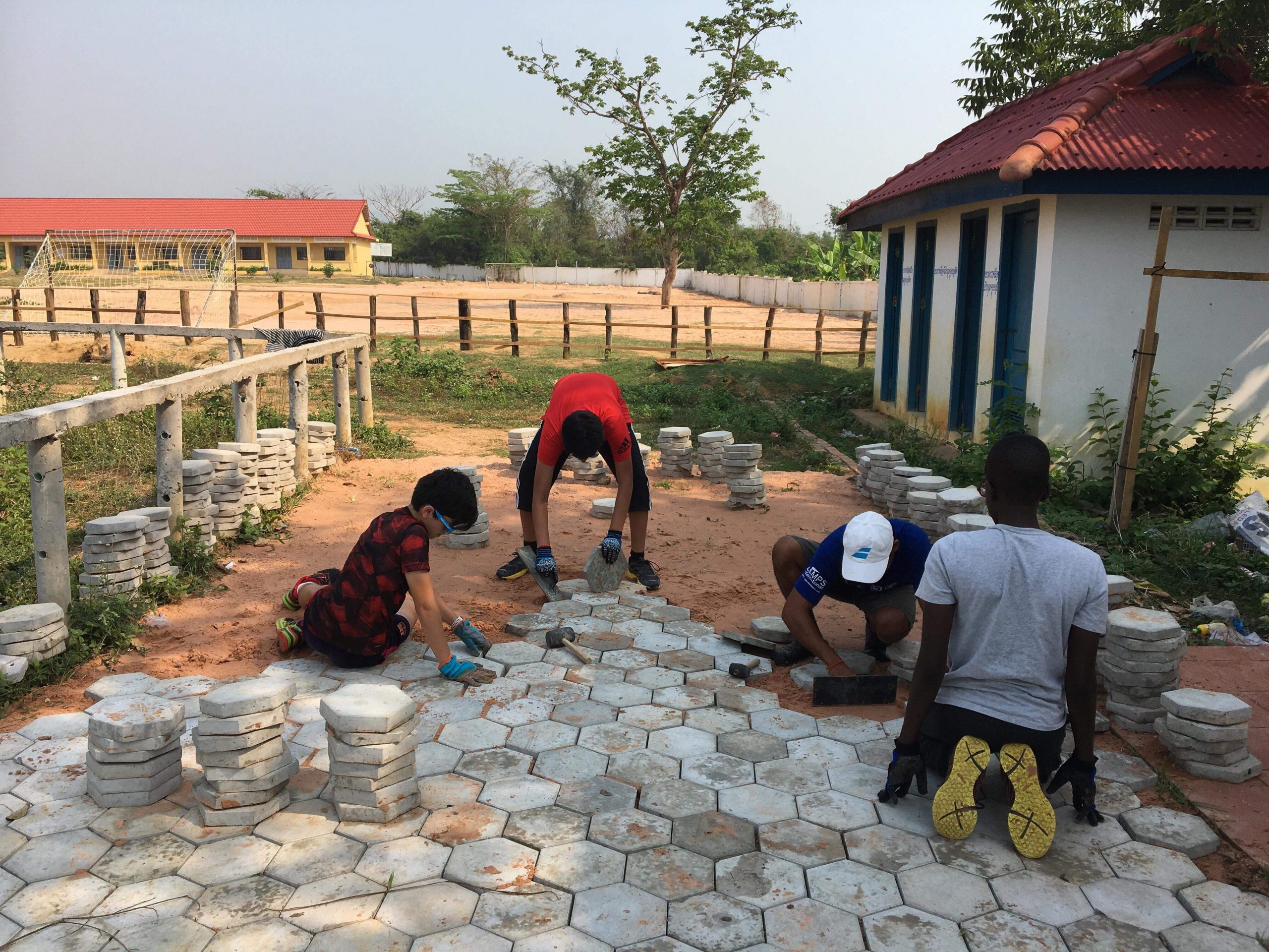 Group of people laying path