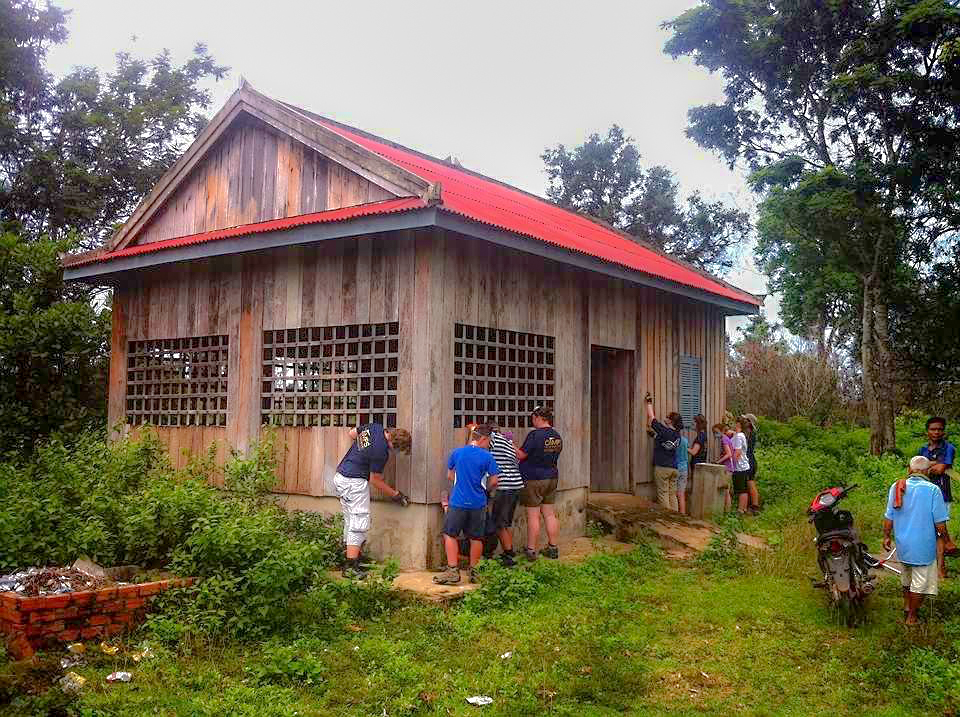 school_expedition_cambodia_trek_painting_building