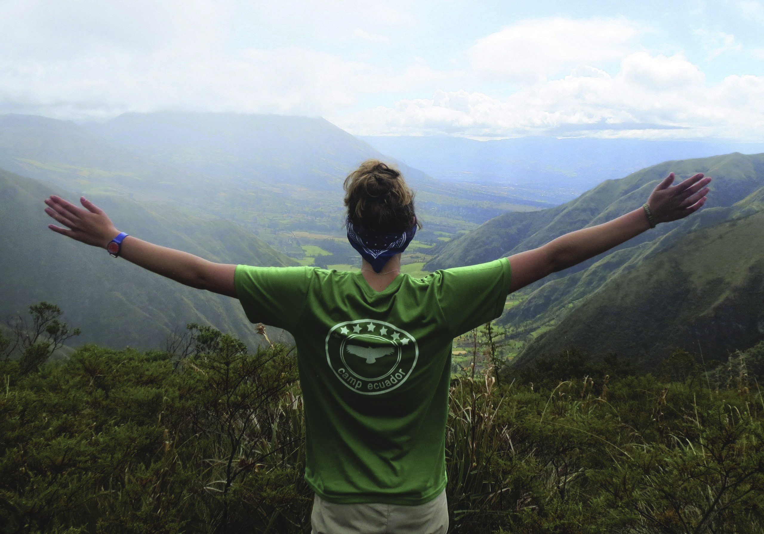 Traveller on Ecuador Trek with view across the valley.