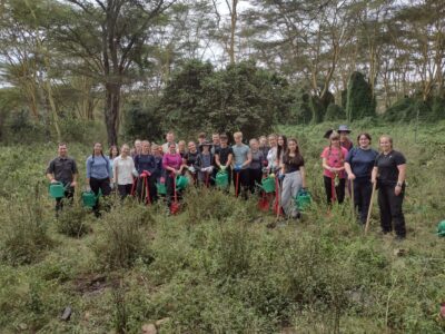 Group of travellers planting trees in Kenya