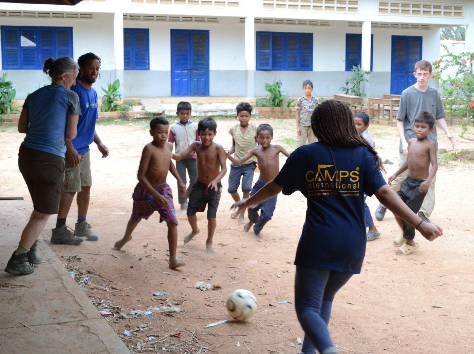 volunteer_playing_football_with_local_school_children