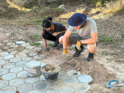 Group of students on a Camps International expedition working on service-led projects alongside the local community in Cambodia, learning lessons beyond the classroom.
